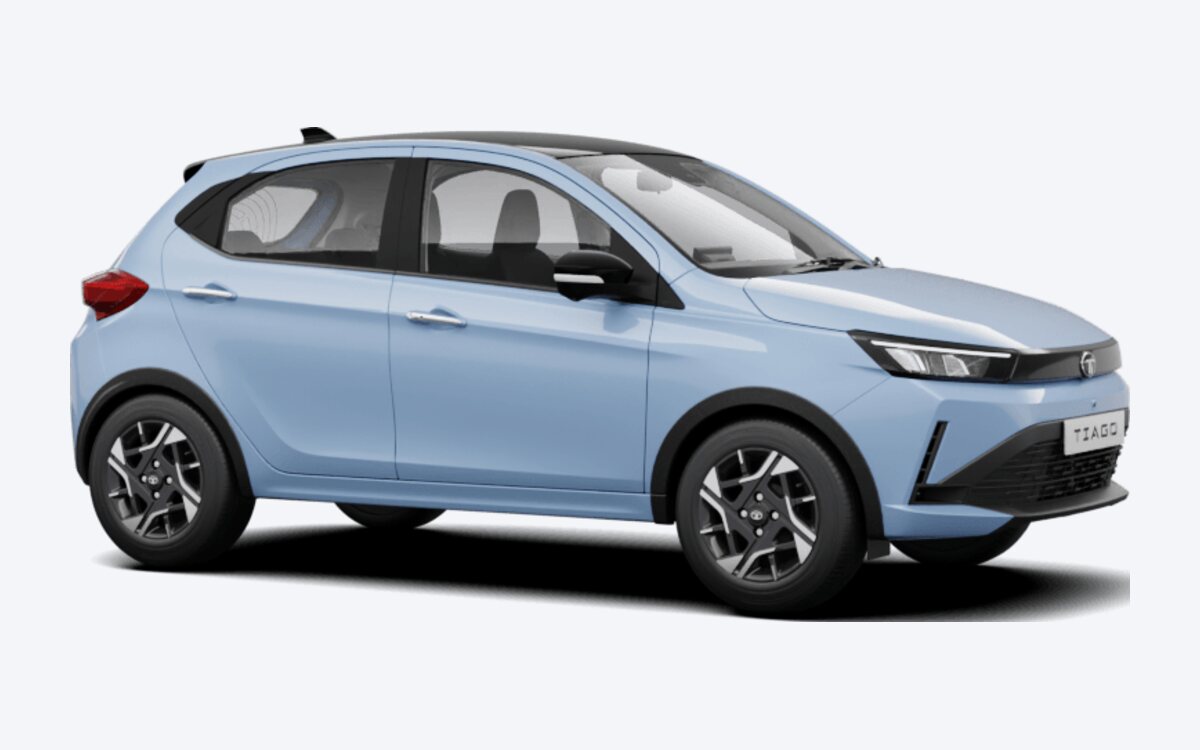 Tata Tiago in Pangong Pulse light blue with a black roof, seen from the front side