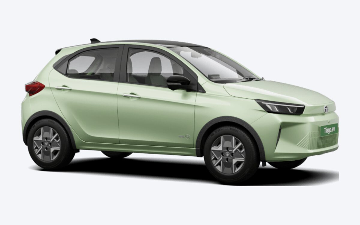 Tata Tiago.ev in Dehradun Dew green with a black roof, seen from the front side