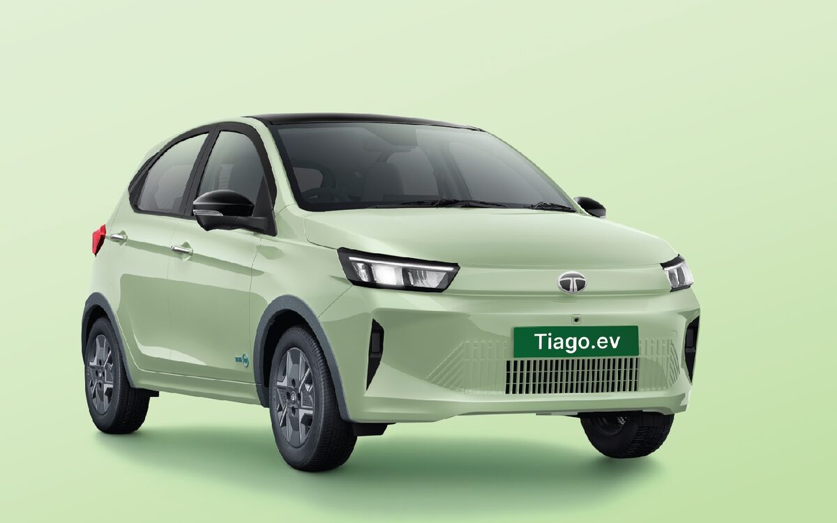 Tata Tiago.ev in Dehradun Dew on a soft green background