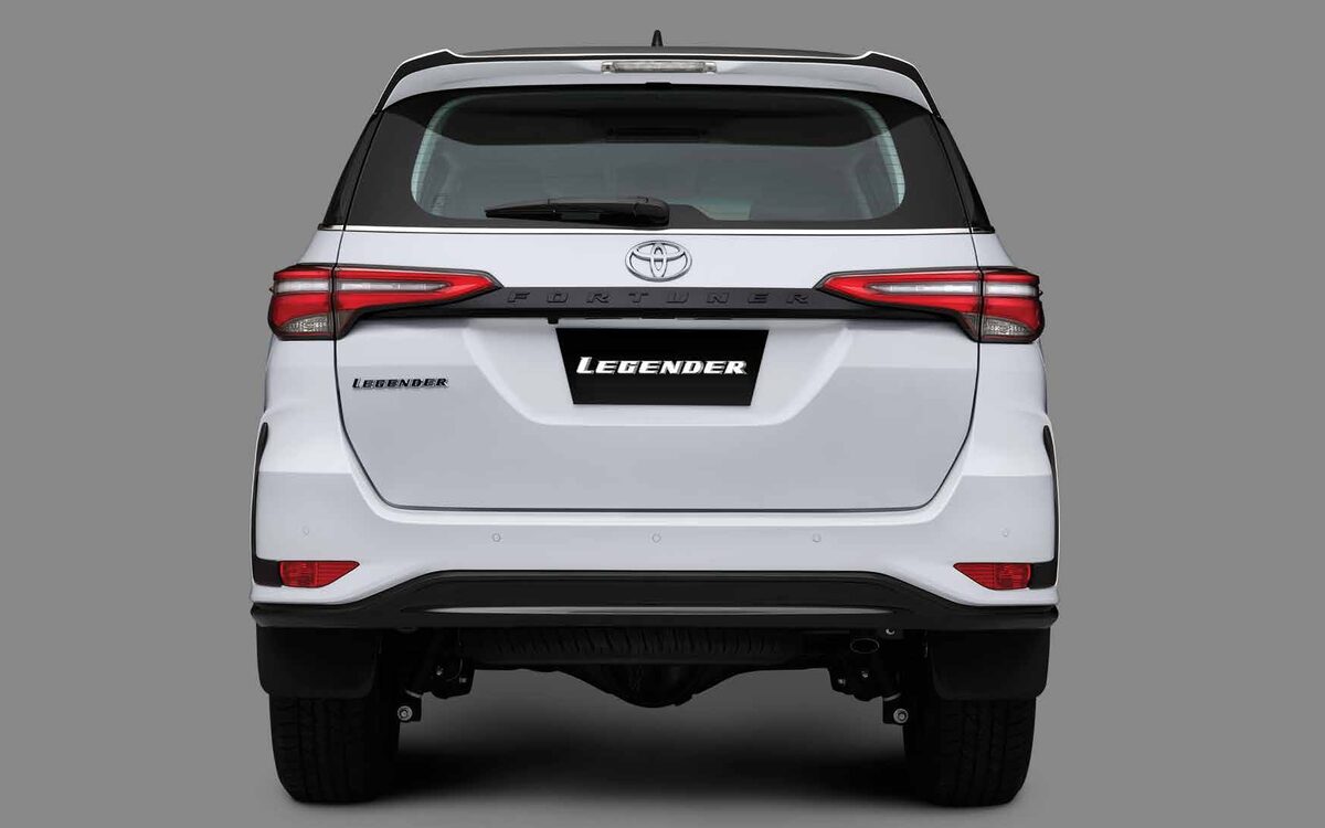 Toyota Fortuner Legender in white, straight rear view showing the tail lamps and black garnish