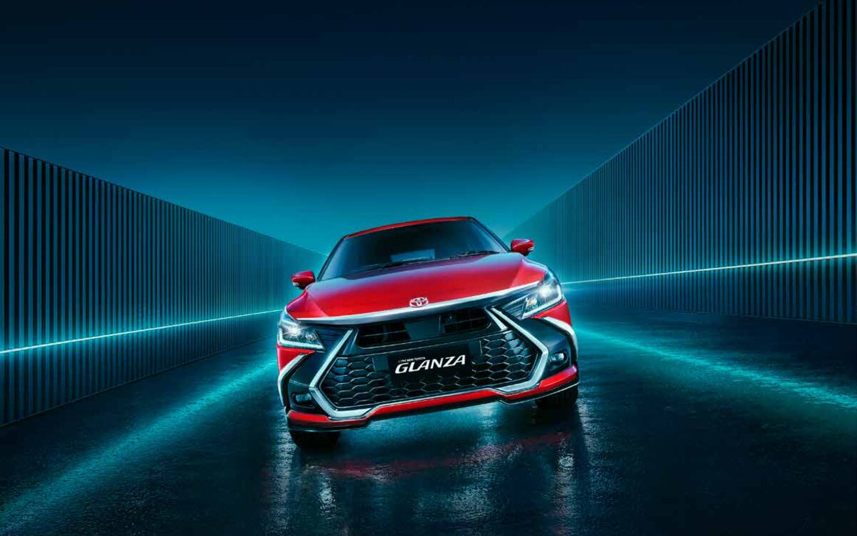 Toyota Glanza in red, head-on front view with the new grille