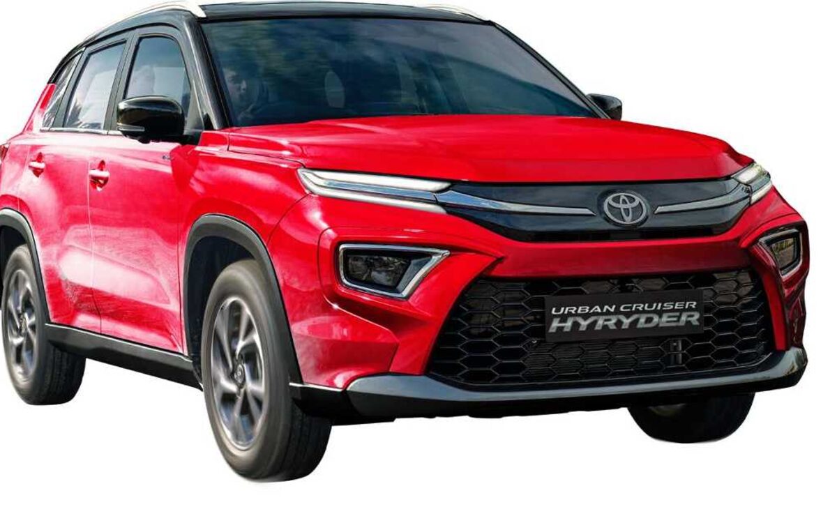 Close view of the front grille, headlamp and bumper of a red Toyota Urban Cruiser Hyryder