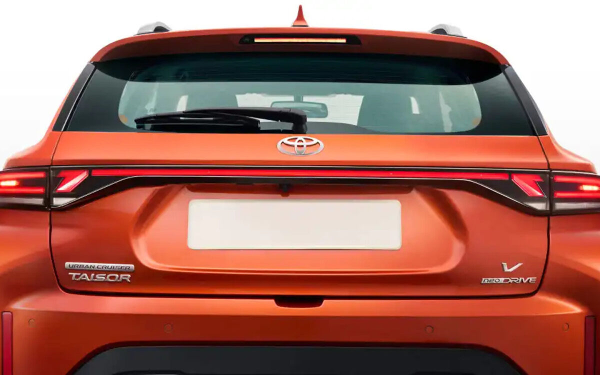Rear of an orange Toyota Urban Cruiser Taisor with the connected LED tail lamp