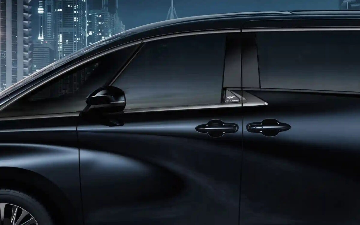 Close-up of the Toyota Vellfire side with sliding doors and door handles